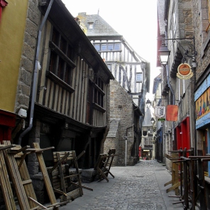 Early Morning in Dinan, a charming street waits in readiness to be transformed in to a bustling restaurant strip in spring.