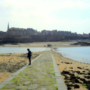 St Malo in the distance while the tide rushes in to trap the unwary traveler lingering at Chateaubriand's tomb. https://amaviedecoeurentier.wordpress.com/2015/03/03/rebel-without-a-causeway/