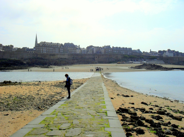 St Malo in the distance while the tide rushes in to trap the unwary traveler lingering at Chateaubriand's tomb.