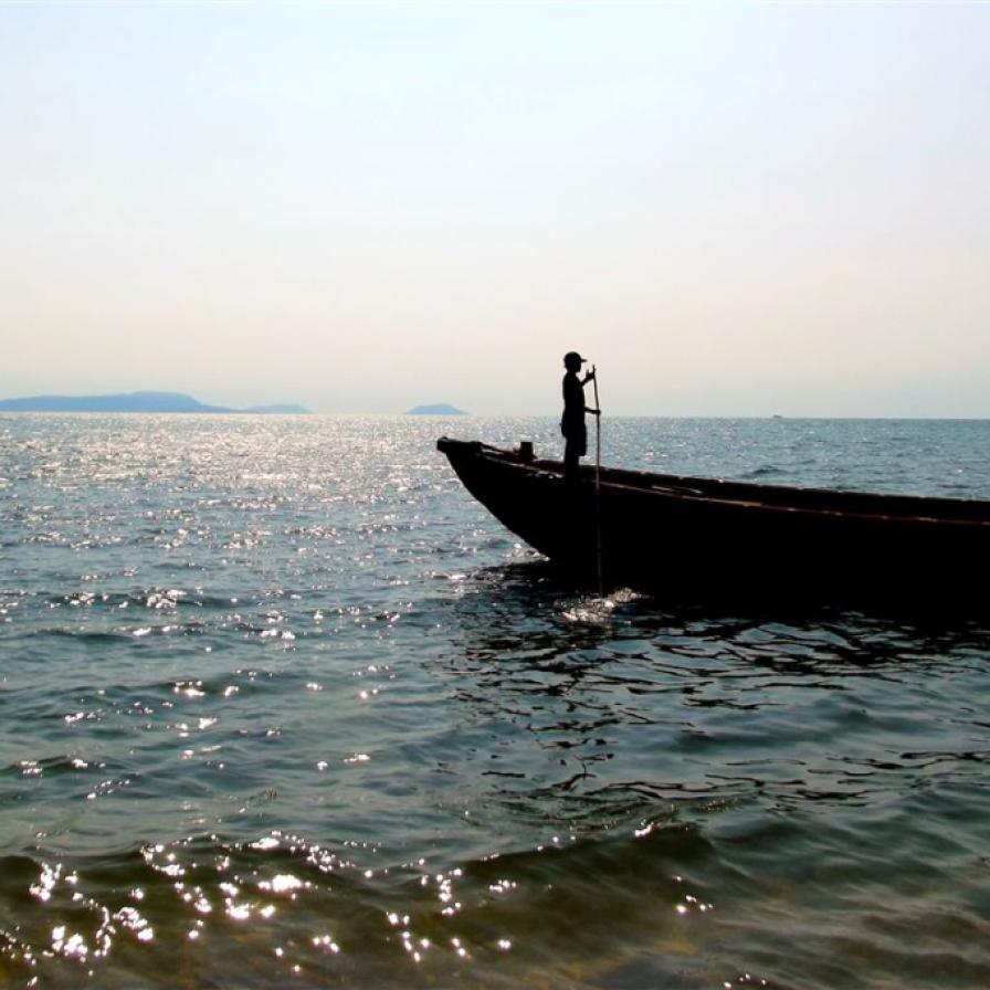 The boatman waits patiently for the return journey